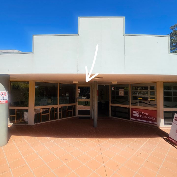 Front of The Highfields Centre, with an arrow pointing to the glass entrance door