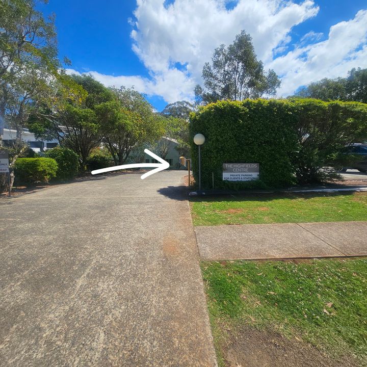 Driveway beside The Highfields Centre sign reading “Private parking for clients & staff only”, with an arrow pointing into the driveway
